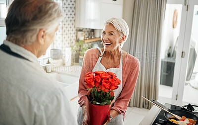 Buy stock photo Flowers, love and cooking with a senior couple in a kitchen forsurprise breakfast in celebration of an anniversary, birthday or valentines day. Food, romance and morning with an elderly man and woman