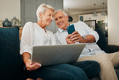 Buy stock photo Phone, social media and laptop with a senior couple at home to relax on a sofa in the living room. Happy, love and smile with an elderly male and female pensioner sharing together in their house