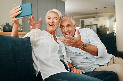 Buy stock photo Comic senior couple, laughing and selfie sitting at home feeling happy and playful during retirement and free time on sofa at home. Funny old man and woman enjoying video call in Australia house