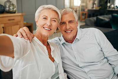 Buy stock photo Senior couple, smile and selfie sitting at home feeling happy and enjoying retirement and free time to relax on sofa at home. Portrait of old man and woman showing love and support in Australia house