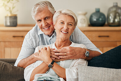 Buy stock photo Happy, smile and portrait of senior couple sitting on sofa in the living room of the house. Love, hug and calm elderly man and woman from canada relaxing and enjoying time together in lounge at home.