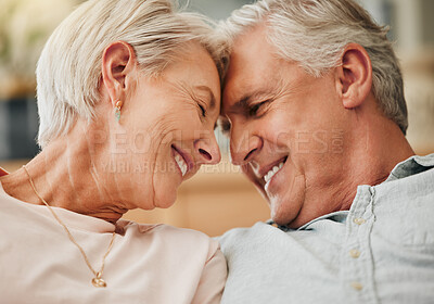 Buy stock photo Senior couple, love and touching forehead with a happy and romantic couple showing love, care and support while sitting together at home. Closeup smile European old man and woman in healthy marriage