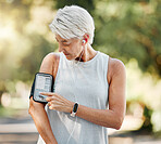 Senior woman with phone running app for steps, fitness and training exercise tracking while on run, walk or cardio workout. Retirement lifestyle, runner and elderly wellness person with health goal