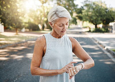 Buy stock photo Fitness runner or senior woman with smartwatch check exercise results, process or goal for healthy, wellness lifestyle. Elderly sports person on digital technology typing workout steps or data on arm