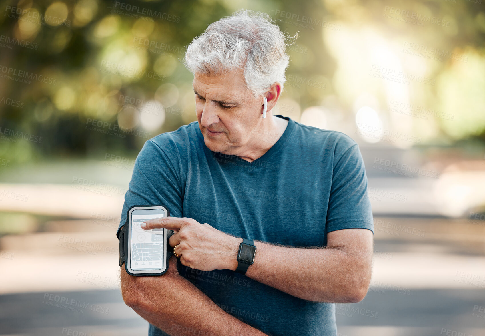 Buy stock photo Senior man, phone band and fitness with music earphones in nature park, environment or Australian garden. Mature runner with 5g mobile technology for radio playlist, exercise training and workout app