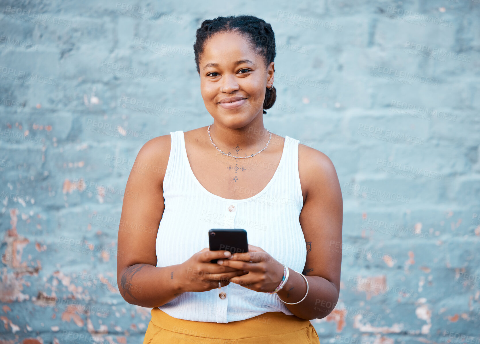 Buy stock photo Black woman, portrait and phone for social media typing, contact and communication on smartphone technology on wall background in Nigeria. Happy gen z girl on mobile apps, 5g internet and web connect