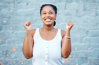 Buy stock photo Happy black woman, smile and winner in success for victory. deal or prize against a wall background. Excited African female smiling in celebration happiness for winning achievement with arms raised