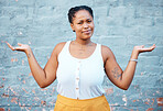 Portrait of confused black woman in doubt with a question and unsure gesture with arms up. Asking why, confusion and clueless girl with hands raised standing by a wall outside in urban town or city