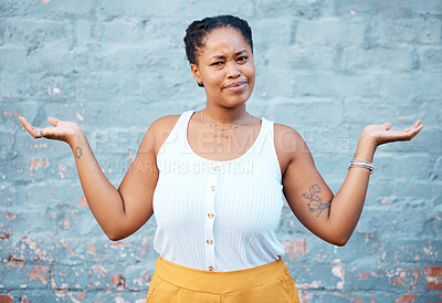 Buy stock photo Portrait of confused black woman in doubt with a question and unsure gesture with arms up. Asking why, confusion and clueless girl with hands raised standing by a wall outside in urban town or city