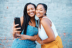 Black women, friends and selfie while smiling and happy outside against city or urban wall and posing for friendship social media picture outside. African females or sisters with 5g network connection