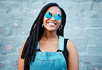 Portrait of black woman with sunglasses in the city and a smile on her face. Young fashion model, summer and happy girl with glasses, trendy accessories and street clothes smiling in an urban town