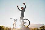 mountain bike, motorcycle man with success, yes or fist pump for fitness achievement goal, motivation or success in outdoor nature with blue sky mockup. Sports person with adventure bicycle on hill