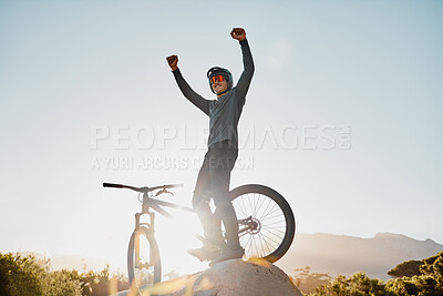 Buy stock photo Mountain bike winner or motorcycle man with success, yes or fist pump for fitness achievement goal or motivation outdoor and blue sky mockup. Sports person winning with adventure bicycle on a hill