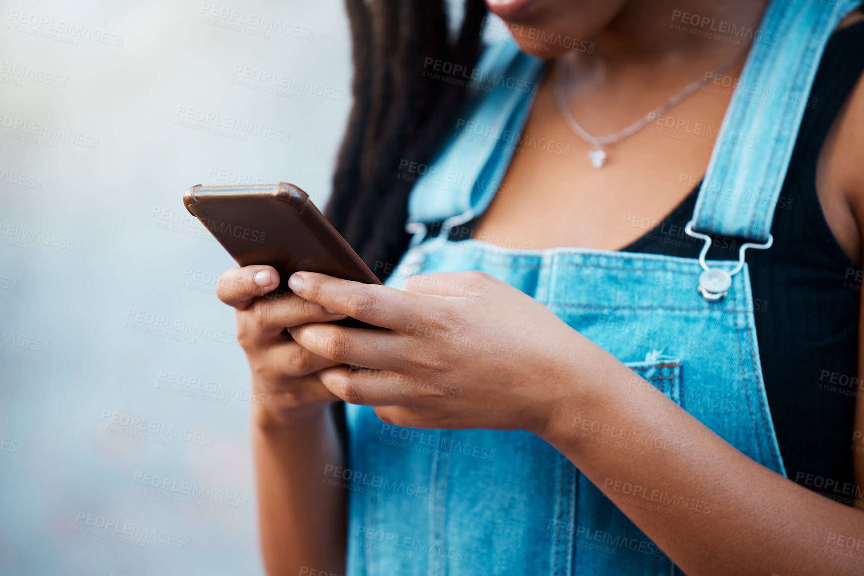 Buy stock photo Gen z black woman hands, social media and city phone typing, contact and communication on smartphone internet technology in Jamaica city. Closeup urban girl mobile apps, connect to 5g website online