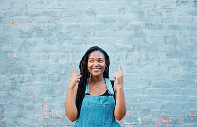 Buy stock photo Black woman fingers pointing to advertising mockup or marketing space on blue wall outdoor youth lifestyle. Happy gen z or african teenager hands showing blank information sign for a sale mock up