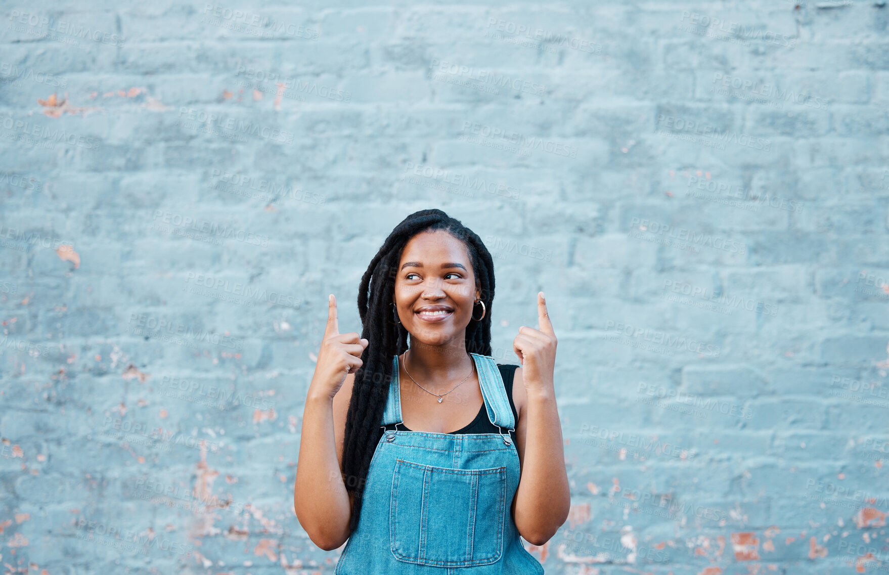 Buy stock photo Black woman fingers pointing to advertising mockup or marketing space on blue wall outdoor youth lifestyle. Happy gen z or african teenager hands showing blank information sign for a sale mock up