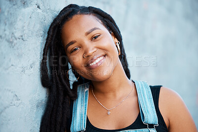 Buy stock photo Black woman, face and freedom with a strong, independent or free female standing outdoor with a smile. Portrait of gen z with a millennial youth outside against a blue wall background