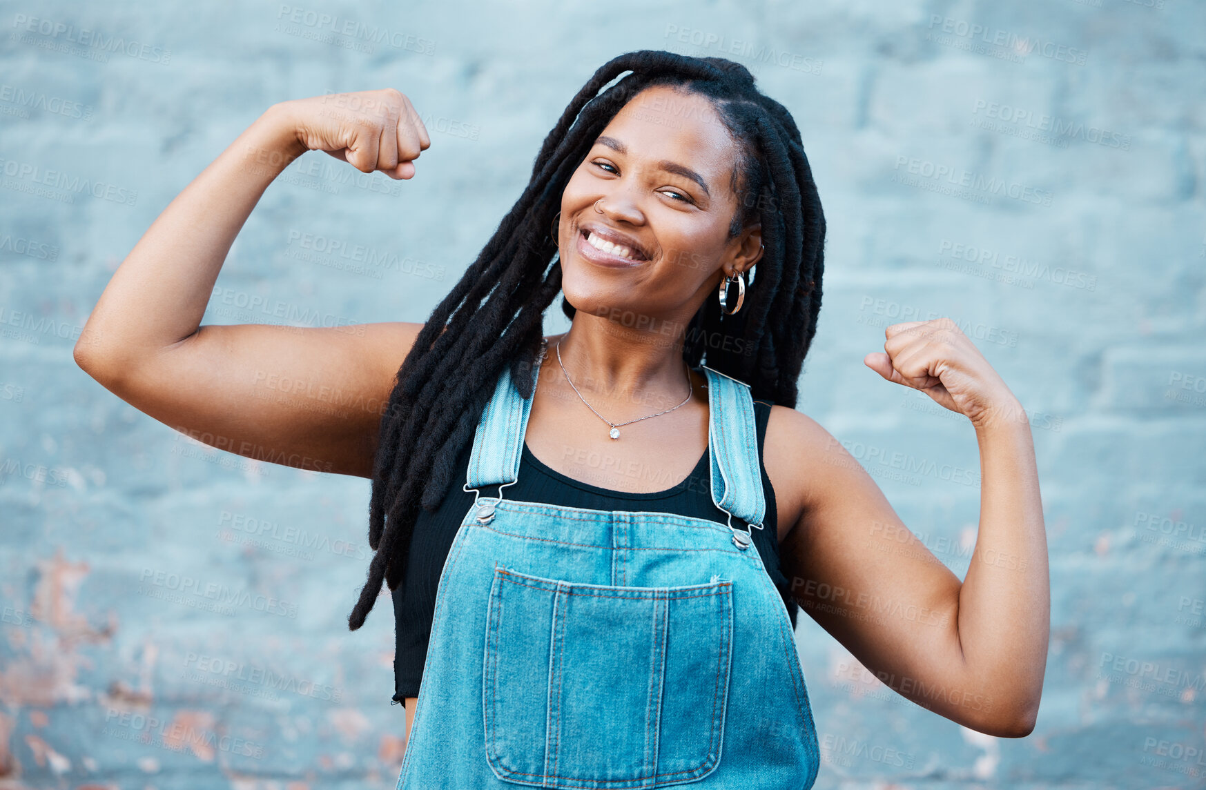 Buy stock photo Happy black woman, portrait smile and muscle power, strength and confident pose on wall background. Proud African female flexing biceps, muscles and smiling for women empowerment in South Africa