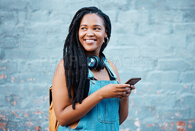 Buy stock photo Social media phone, music headphones and black woman thinking of motivation going to university in city. African college student with vision for future listening to podcast on mobile in Canada