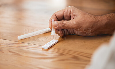 Buy stock photo Hands, covid antigen test or dropper in home kit, house or living room for healthcare insurance or medical virus disease. Zoom, man or pcr covid 19 check for patient in isolation lockdown compliance