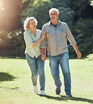 Buy stock photo Senior couple walking in park, garden and sunshine to relax, wellness and fresh air in nature in Australia together. Happy man, smile woman and elderly people holding hands, enjoy retirement and love