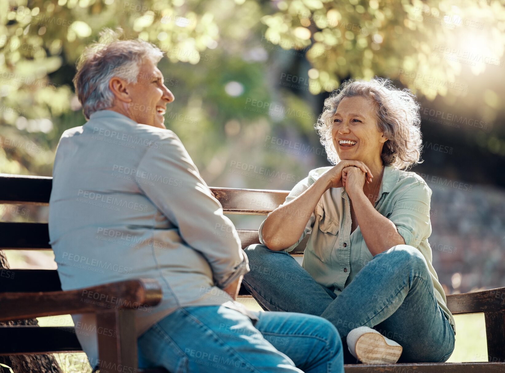 Buy stock photo Park bench, couple and senior people with love and happiness in nature enjoying summer. Happy smile of elderly woman and man retirement together relax laughing outdoor having a fun conversation 