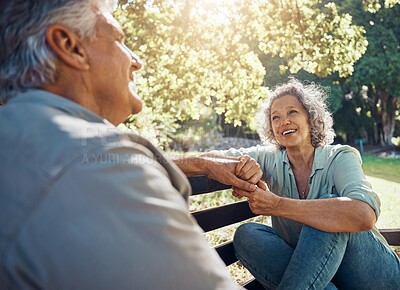 Buy stock photo Elderly, couple and happy on bench in garden for conversation, bonding and happiness by trees in summer. Man, woman and retirement show love, relax and smile together in nature with sunshine at park