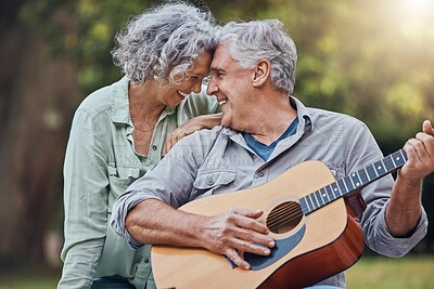 Buy stock photo Senior couple, guitar and love in a park together playing a romantic, love or affection music song for wife. Romance, retired senior man and woman play string instrument and laugh outdoor in forest 