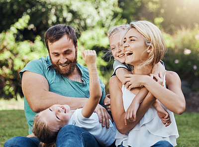 Buy stock photo Family, children and nature with playing mother, kids and father in the park during summer, laughing and having fun together. Happy, freedom and playful with a girl, boy and parents sitting on grass