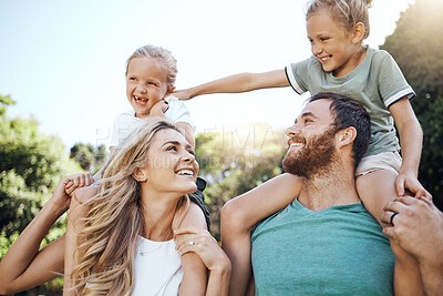 Buy stock photo Mom and dad with kids on their shoulder in the garden, playing together. Love, young and happy family bond and have fun in a park on a summer day. Father, mother and daughters enjoy being in nature