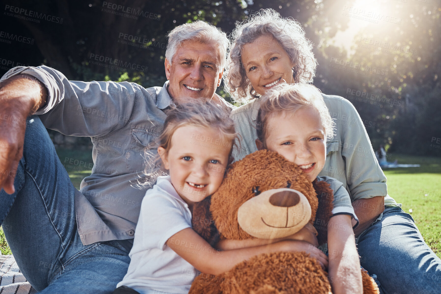 Buy stock photo Family, children and teddy bear with a girl, grandparents and sister on the grass in a nature park during summer. Kids, haooy and love with senior man, woman and grandchildren outdoor in the day