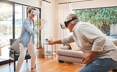 Buy stock photo VR, gaming and metaverse with a senior couple playing a video game in their home for fun together. 3d, virtual reality and internet with an elderly gamer and his wife enjoying an immersive experience