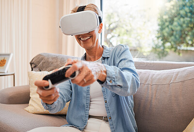 Buy stock photo An elderly woman, virtual reality gaming and in retirement playing 3d online game in the living room of house. Senior grandmother in metaverse, vr technology and racing esports on sofa from her home 