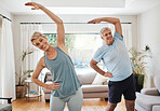 Stretching, healthy and fitness with a couple doing an exercise, workout or training at home for health and wellness, lifestyle and active with a fit senior man and woman exercising in their house