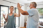 High five, success or senior couple fitness, workout or exercise in the living room at home. Smile, happy or sports teamwork gesture for retirement man and woman health, goals and training together