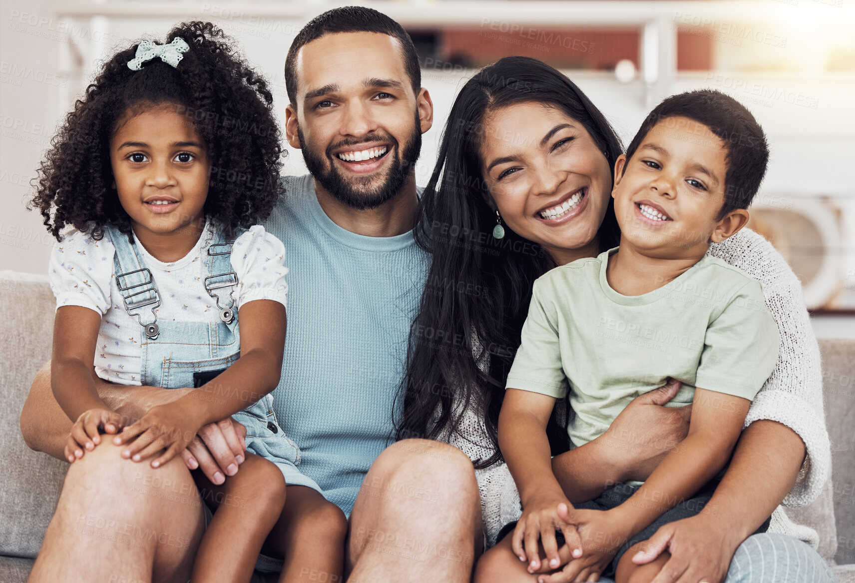 Buy stock photo Happy, smile and portrait of a family bonding and relaxing together at home in puerto rico. Happiness, love and parents resting and holding their children with care at their comfortable house.