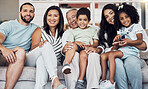 Family, sofa and happy in living room in portrait together in home or on vacation. Children, parents and grandparents love, happiness and smile while on holiday, in hotel or house in Houston, Texas