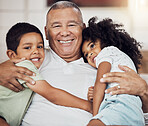 Portrait, happy family and grandfather with children in the house living room hugging, relaxing and bonding together. Elderly, happiness and old man has a big smile enjoying quality time with kids 