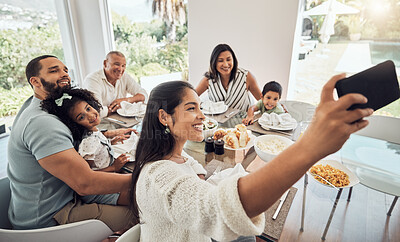 Buy stock photo Big family, phone selfie and food in home, eating and spending time together on table. Generations, grandfather and parents with kids smiling sharing lunch picture post on social media on 5g mobile.
