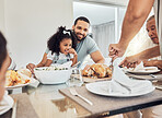 Family lunch in dining room, happy father with young girl child and woman cutting roast chicken in Atlanta. Hungry daughter eating supper at dinner table, smile together on weekend and home food