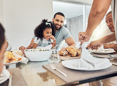 Buy stock photo Family lunch in dining room, happy father with young girl child and woman cutting roast chicken in Atlanta. Hungry daughter eating supper at dinner table, smile together on weekend and home food