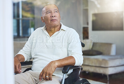 Buy stock photo Disabled, sad and senior man thinking of accident in a wheelchair by the window in the living room in his house. Elderly man with depression, disability and retirement idea in a nursing home 