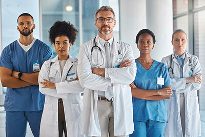 Doctors, nurses and team portrait in hospital, clinic or medical office. Diversity, health and healthcare professionals standing together arms crossed in confidence teamwork, collaboration or support