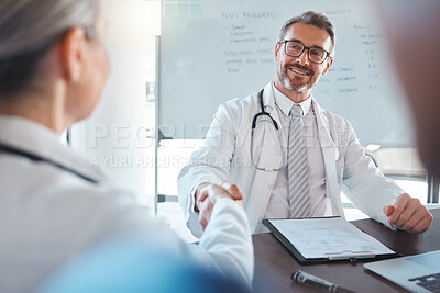 Buy stock photo Doctor handshake, medical welcome and man consulting with team for healthcare planning at hospital. Mature employee working in medicine meeting a consultant for collaboration and help at clinic