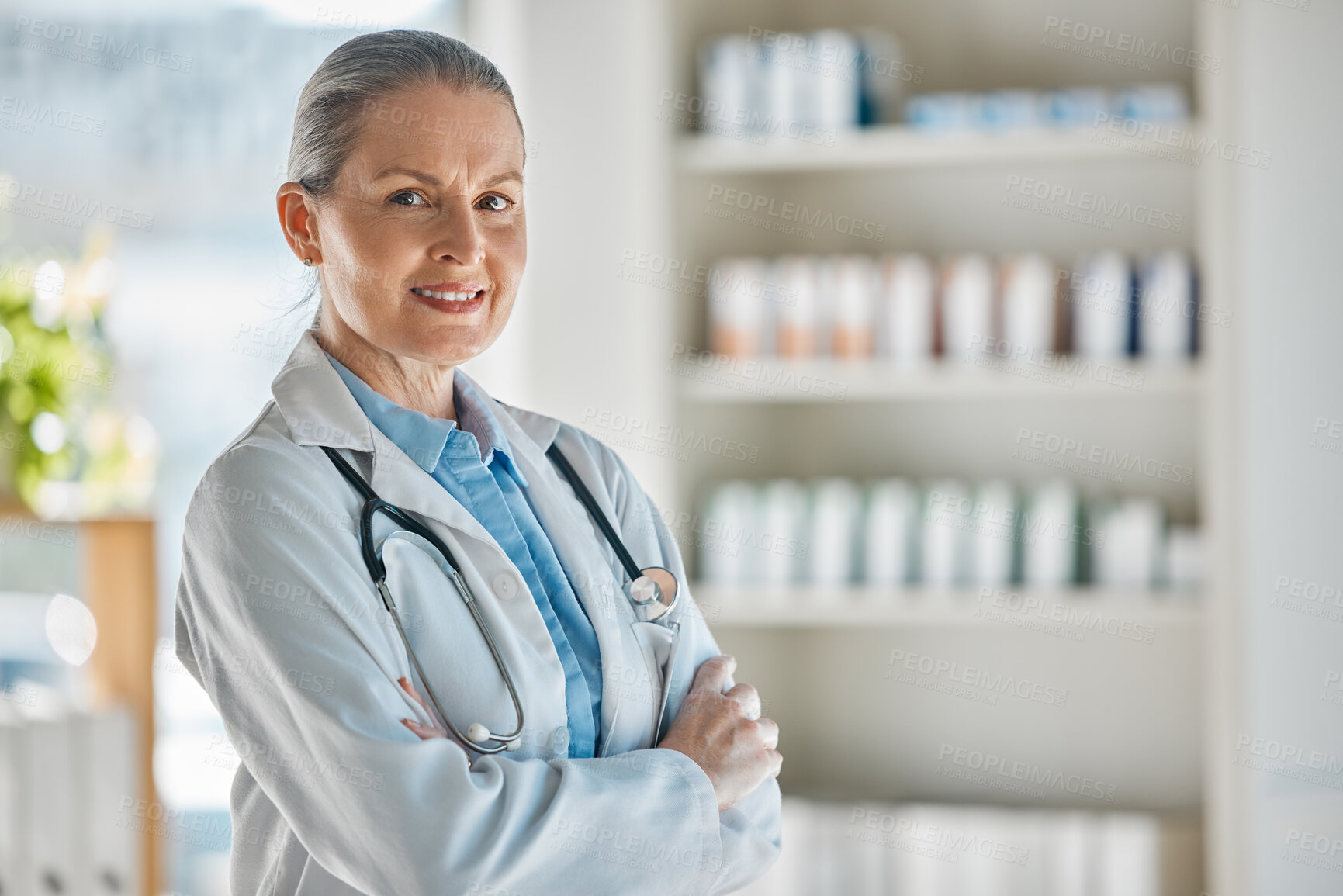 Buy stock photo Medical portrait, healthcare doctor and woman with smile for working in medicine at a pharmacy. Happy, mature and expert pharmacist with arms crossed and pride while consulting in a hospital 