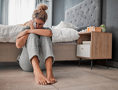 Buy stock photo Crying, sad and depressed woman on bedroom floor using wipe for tears struggling with mental health, depression and anxiety after heartbreak or breakup. Upset or sick female cry about problem at home