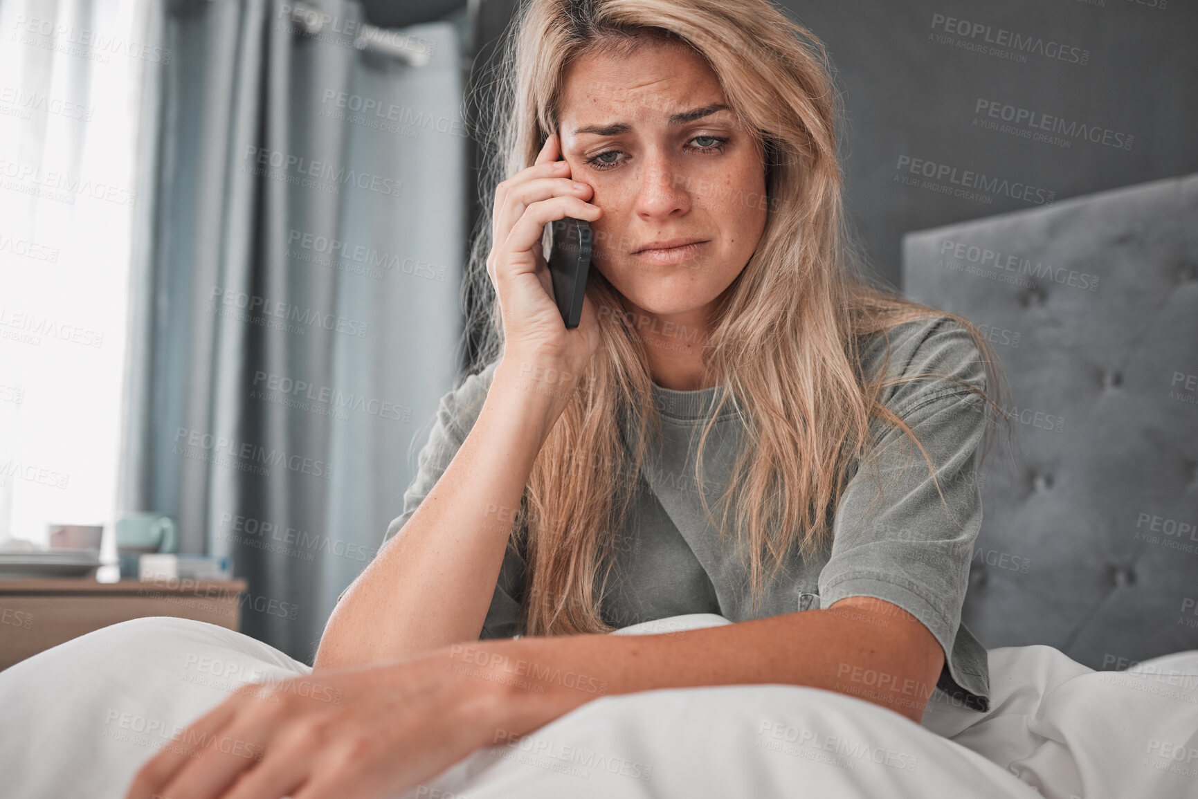 Buy stock photo Sad, stress and woman with depression in a phone call conversation in her bedroom worried about a break up. Mental health, anxiety and depressed girl disappointed after listening to bad news at home