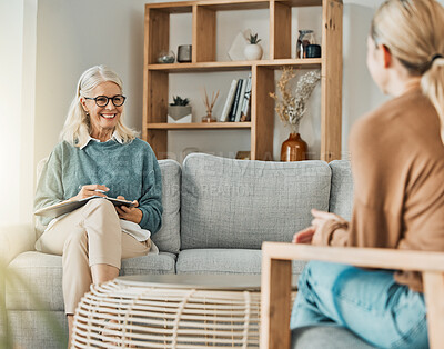 Buy stock photo Woman talking with therapist about depression, anxiety and mental health problems in her life. Psychologist listening with patience, understanding and compassion on couch while writing therapy notes 