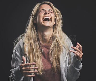 Buy stock photo Mental health, crazy and bipolar woman laughing or shouting in dark studio for psychology, depression or identity problem. Drugs addiction, schizophrenia or horror girl psychedelic after abuse