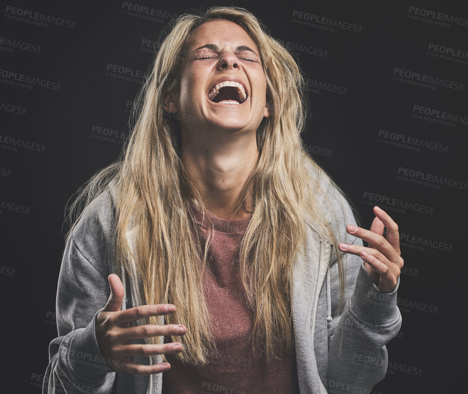 Buy stock photo Mental health, crazy and bipolar woman laughing or shouting on a dark studio for psychology. Drug addiction, schizophrenia or horror girl with split personality, psychedelic and epilepsy after abuse